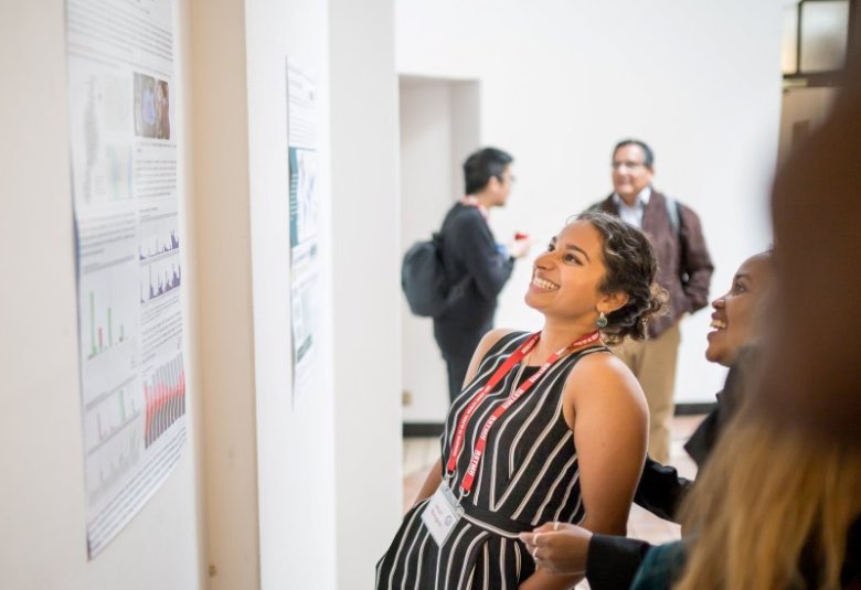 Attendee viewing poster presentation