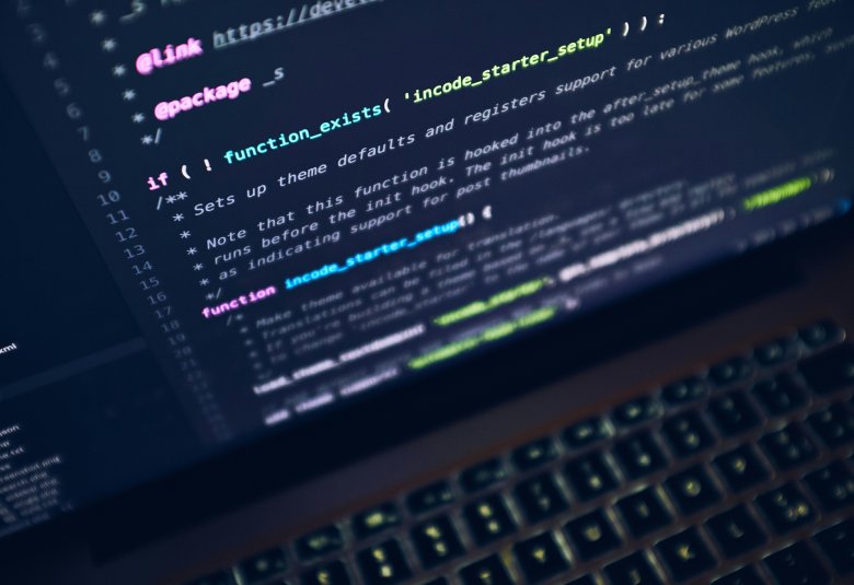 A photo showing some code on a laptop screen