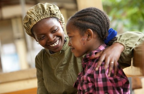 © Geoff Oliver Bugbee/Orbis Orbis-trained integrated eye care worker, Tsehay comforts 13-year-old Asegedech, who is suffering from severe trachoma. Gamo Gofa, Ethiopia.