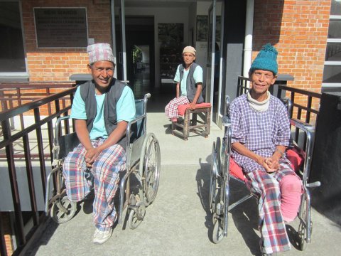 Patients enjoy the winter sun outside TLMN’s Anandaban Hospital Leprosy Ward. Amputated feet highlight delayed diagnosis and the continued need for contact survey, self-care and awareness raising. ​© Tom Bradley/The Leprosy Mission Nepal (TLMN) 