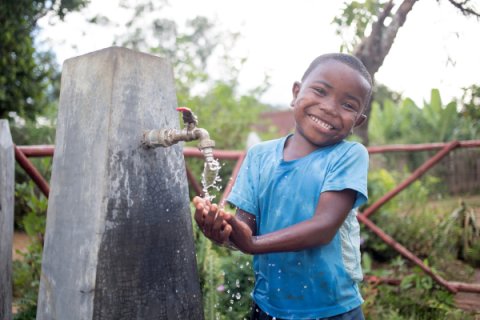 Bryan washing his hands at his water point in Antanambao village, Belavabary commune, Moramanga district, Alaotra Mangoro region, Madagascar, March 2018. Credit: WaterAid/ Ernest Randriarimalala