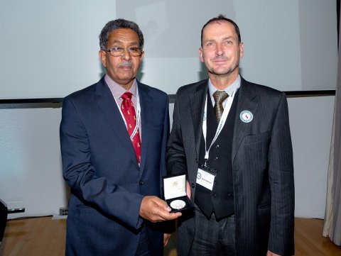 Professor Fahal receiving his award from Simon Cathcart, RSTMH Past President