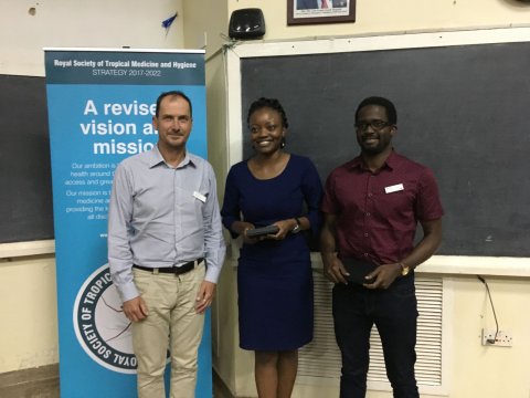 Dr Yvonne Wekesa (centre) and Dr Owachi Darius (right) receive prizes for best poster and oral presentation respectively from RSTMH Past President, Dr Simon Cathcart