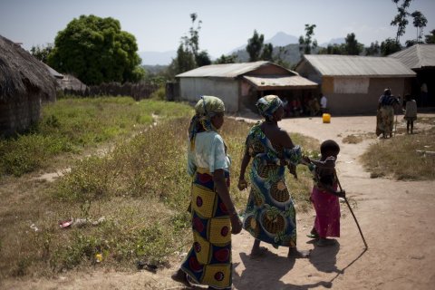 A child using a stick to lead a woman blinded by onchocerciasis in Nigeria © Mectizan Donation Program