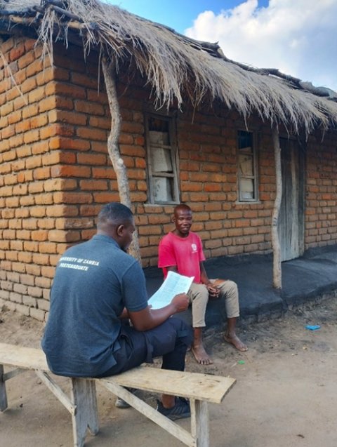 An individual is asked questions from a survey