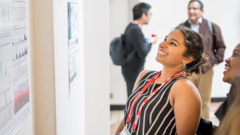 Attendee viewing a poster presentation