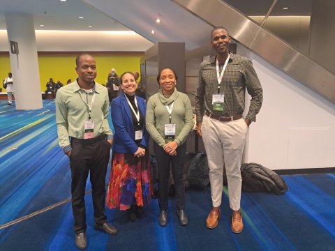 Tamar Ghosh with Simmoy Noble, Simone Sandiford, and Mario Golding.